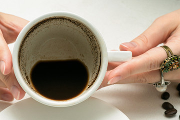 Coffee grounds fortune telling close up. Fortune teller with a cup of coffee.