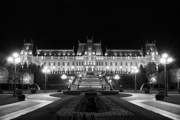 Palace of Culture in Iasi, Romania. Evening illumination of the palace, cityscape. The building combines several architectural styles: neo-Gothic, romantic and neo-baroque.