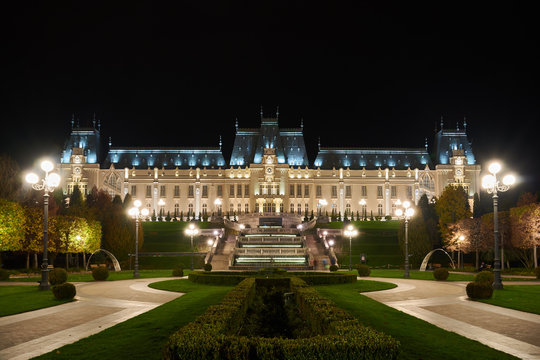 Palace of Culture in Iasi, Romania. Evening illumination of the palace, cityscape. The building combines several architectural styles: neo-Gothic, romantic and neo-baroque.