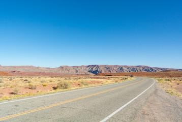 Fototapeta na wymiar Utah, united states of America, USA-October 7th 2019: A landscape with a road in southwestern desert.
