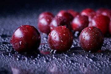 Fresh washed cherry berries with water drops on a background
