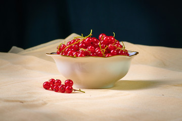 Fresh washed berries of red currant on the background