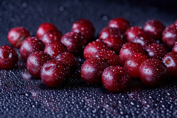 Fresh washed cherry berries with water drops on a background