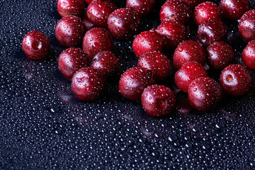 Fresh washed cherry berries with water drops on a background
