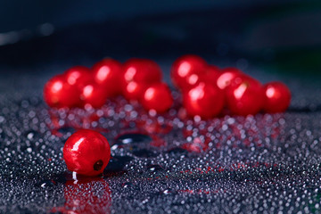 Fresh washed berries of red currant.with water drops on the background