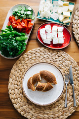 Turkish traditional Breakfast with bagel (Turkish Simit), blur background and in front of the photo there is Turkish Bagel