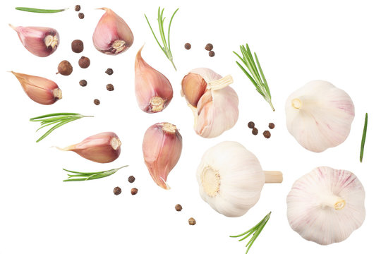 garlic with rosemary, peppercorns and allspice isolated on white background. top view