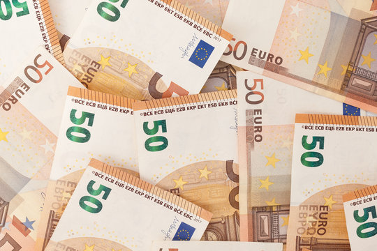 Money background. 50 euro bills top view.