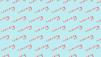 Seamless background pattern of christmas candy cane isolated on azure