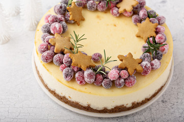 Christmas cheesecake with gingerbread base decorated with sugared cranberries