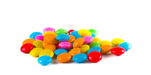colored round candies on a white background