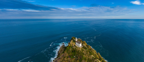 Getaria lighthouse in Gipuzkoa, Basque country - drone aerial view 21:9