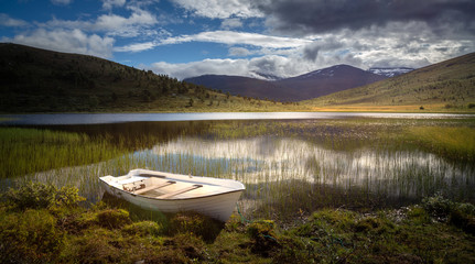 Mountain lake in Jotunheimen National Park, summer hildays.