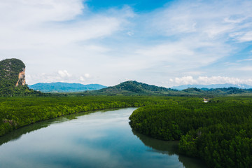 Aerial scenery view of mangroves forest, river canals and mountains. Bird's eye view of beautiful panoramic nature landscape of tropical water jungle on Ao Phang Nga bay National Park, Thailand