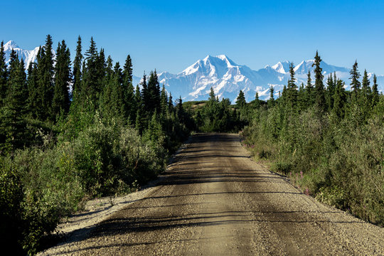 View Of The Road With Mountain In The Distance, Driving The Denali Highway In Alaska In The Summer