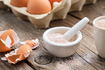 Mortar of crushed eggshell,cardboard box of eggs. Whole and powdered eggshells, natural calcium,...