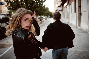 Fototapeta premium Young woman and young man street story