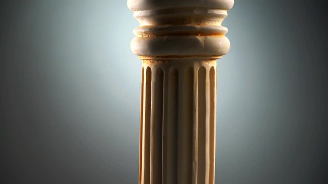 Single ancient greek column on dark background