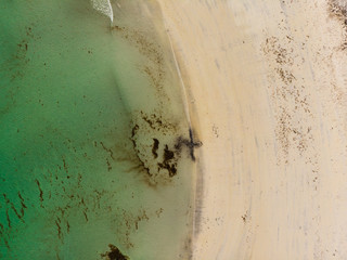 Aerial view. Sea water and sandy shoreline