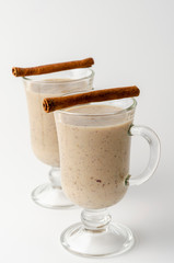 Glasses of date milkshake with cinnamon and