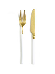 White golden cutlery view from above on a white background. Top view..Knife and fork for a festive table for a wedding, birthday or party.