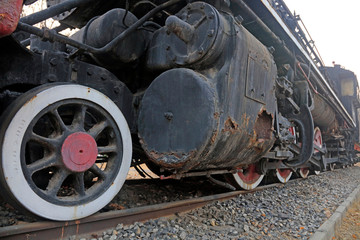 Fototapeta na wymiar Steam locomotive wheel