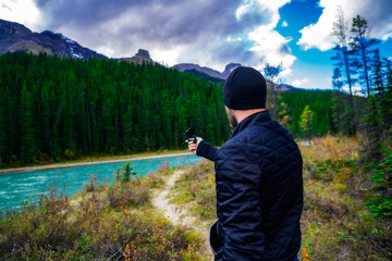 Man In Wild Navigating With Explorer Compass Trekking Outdoors