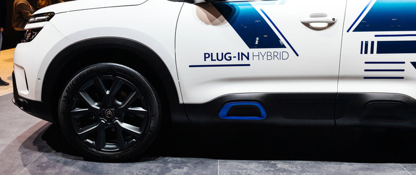 PARIS, FRANCE - OCT 4, 2018: Plug-in hybrid sign on new electric plug in Citroen SUV c5 Aircross hybrid at International car exhibition Mondial Paris Motor Show - side advertising view
