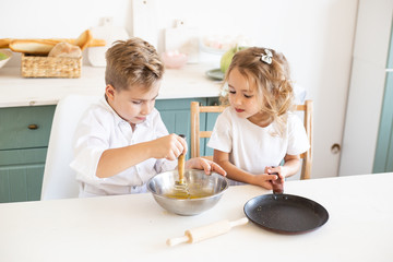 little chefs enjoying in the kitchen prepare food