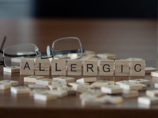 allergic the word or concept represented by wooden letter tiles