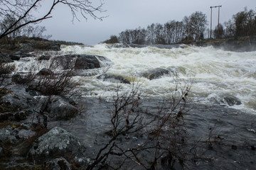 A torrent of water flows down the plain
