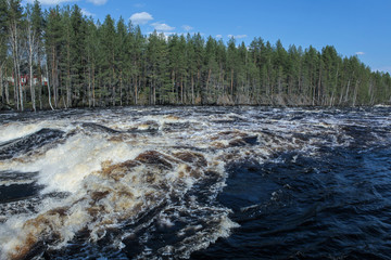 A torrent of water flows down the plain