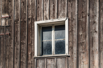 Fototapeta na wymiar Window in an old wooden house in the Principality of Liechtenstein
