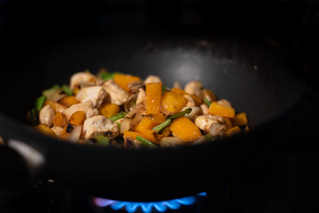 frying pan with meat and vegetables