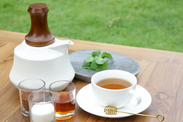 Fresh mint tea served on the wooden table