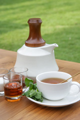 Fresh mint tea served on the wooden table