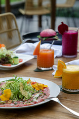 Various healthy vegetarian dishes served on the wooden table