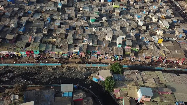 Aerial View on Dharavi Mumbai Slum With Filthy Water Canal, India. Poor Housing Without Sewage System