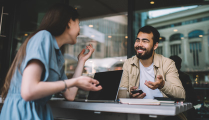 Diverse coworkers talking during break