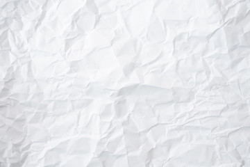 white and gray crumpled paper texture background. crush paper so that it becomes creased and wrinkled.