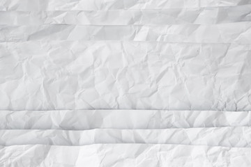 white and gray crumpled paper texture background. crush paper so that it becomes creased and wrinkled.