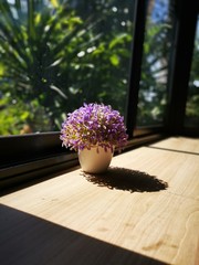 bouquet of flowers in a vase on wooden table