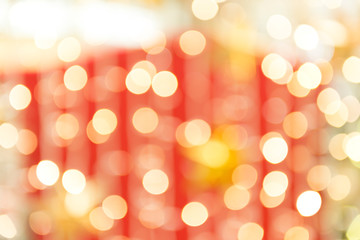 Fototapeta premium white bokeh blur background. Yellow circle light on red background. Light gold sparkle background.