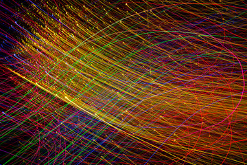 Obraz premium Abstract curved lines of colorful light warm cast