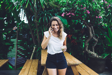 Woman talking on phone in garden