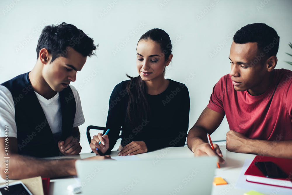 Poster concept of teamwork on startup business project, young millennial people sitting at desktop with lap