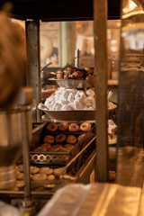 Small Doughnuts Coming Out of Vintage Fryer