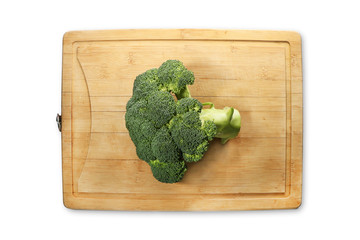 Fresh broccoli on wooden cutting board - isolated on white - wooden background  