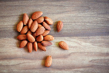Almonds on rustic wooden background top view - Close up almond nuts natural protein food and for snack