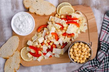 Raw vegetables and chickpeas salad